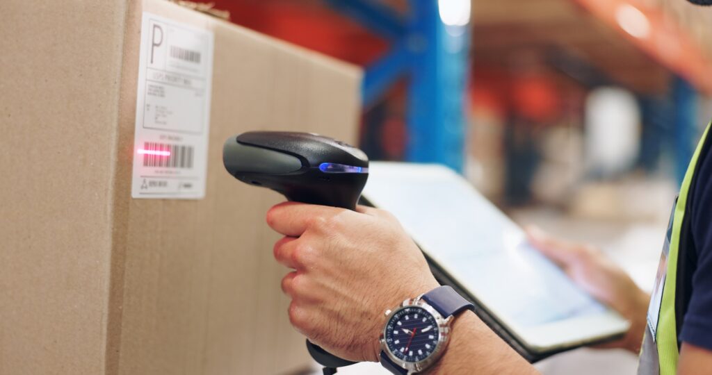 Logistics, hands and man scanning barcode in warehouse with tablet for price or serial number. Card